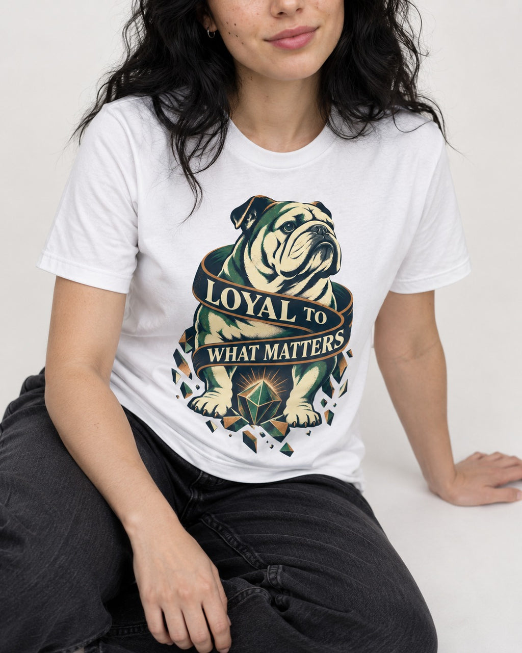 Loyal to What Matters English Bulldog T-Shirt in White, worn by a seated model