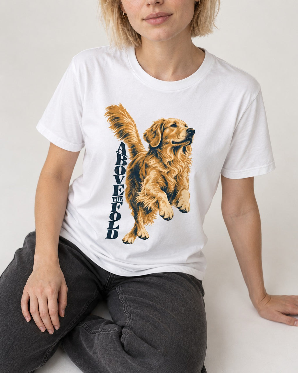 Golden Retriever Above the Fold T-Shirt in White, worn by a seated model