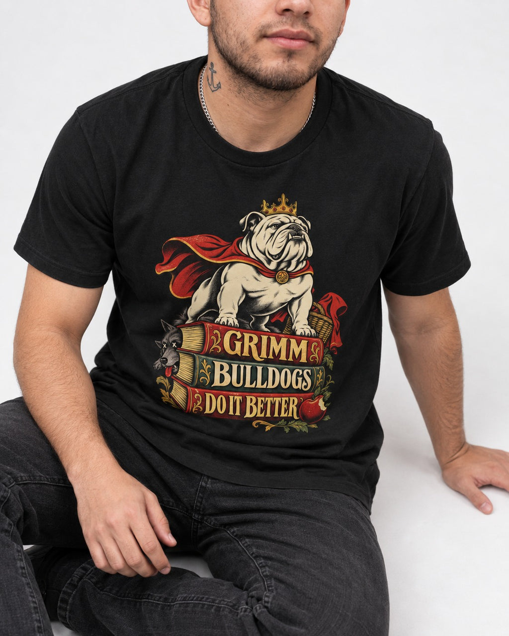 English Bulldog Grimm Bulldogs Do It Better Storybook Graphic T-Shirt in Black, worn by a seated model