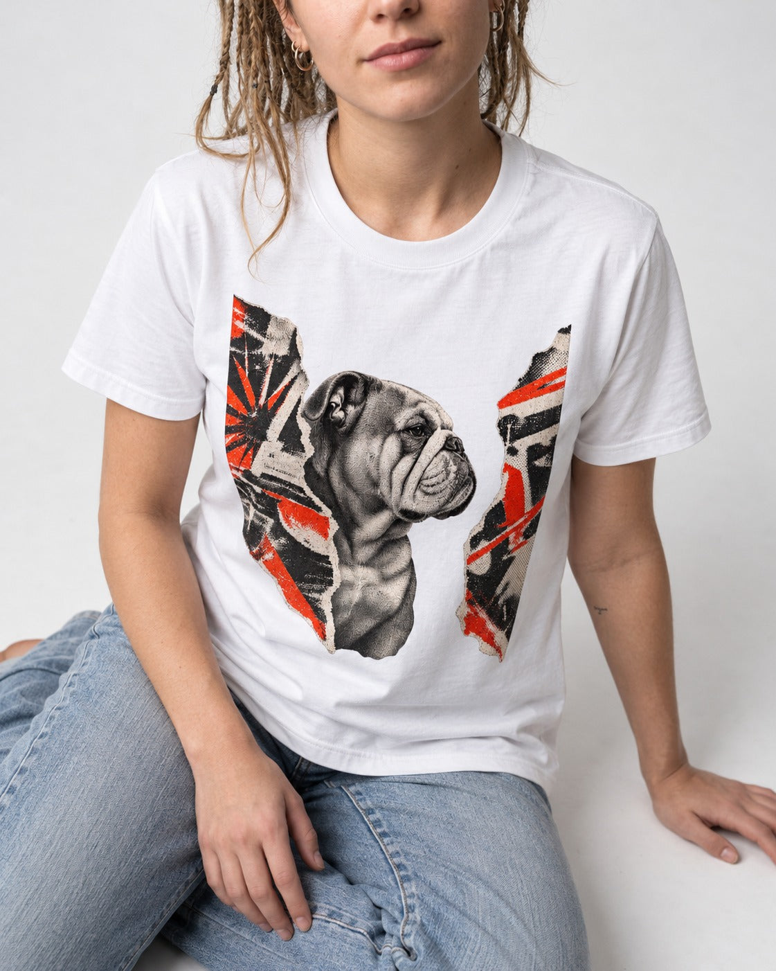 English Bulldog Unbowed T-Shirt in White, worn by a seated model