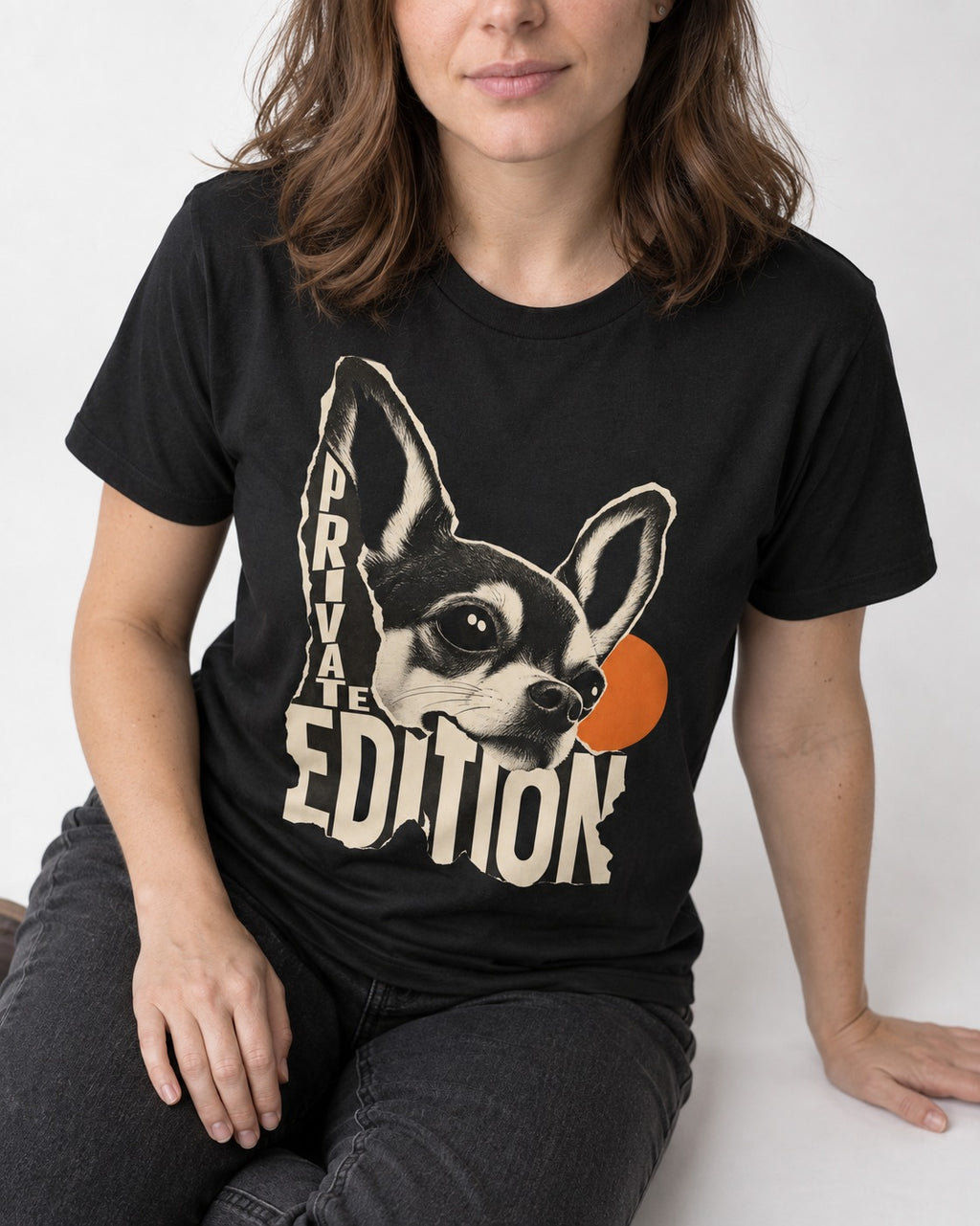 Chihuahua Private Edition Cut-Paper Portrait T-Shirt in Black, worn by a seated model