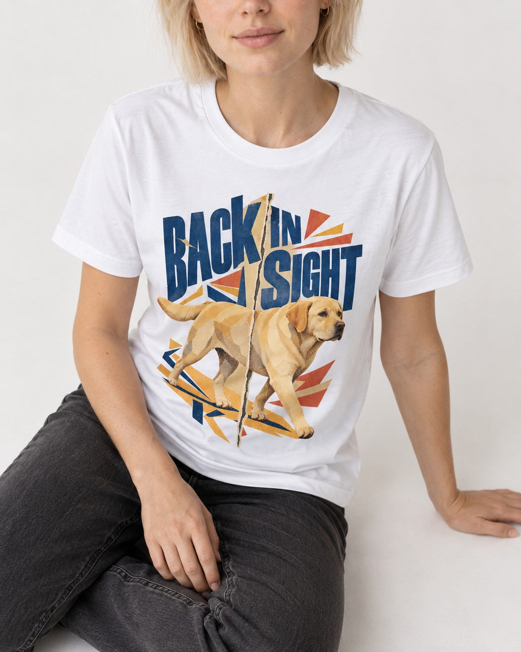 Labrador Retriever Back in Sight T-Shirt in White, worn by a seated model