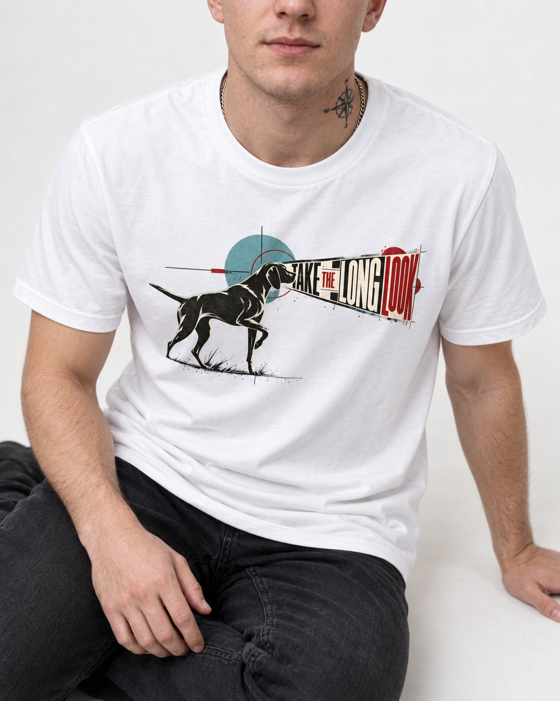 German Shorthaired Pointer Take the Long Look T-Shirt in White, worn by a seated model