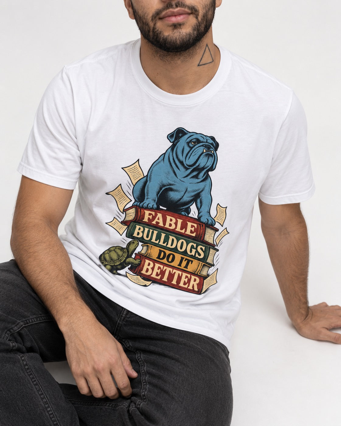 English Bulldog Does It Better T-Shirt in White, worn by a seated model