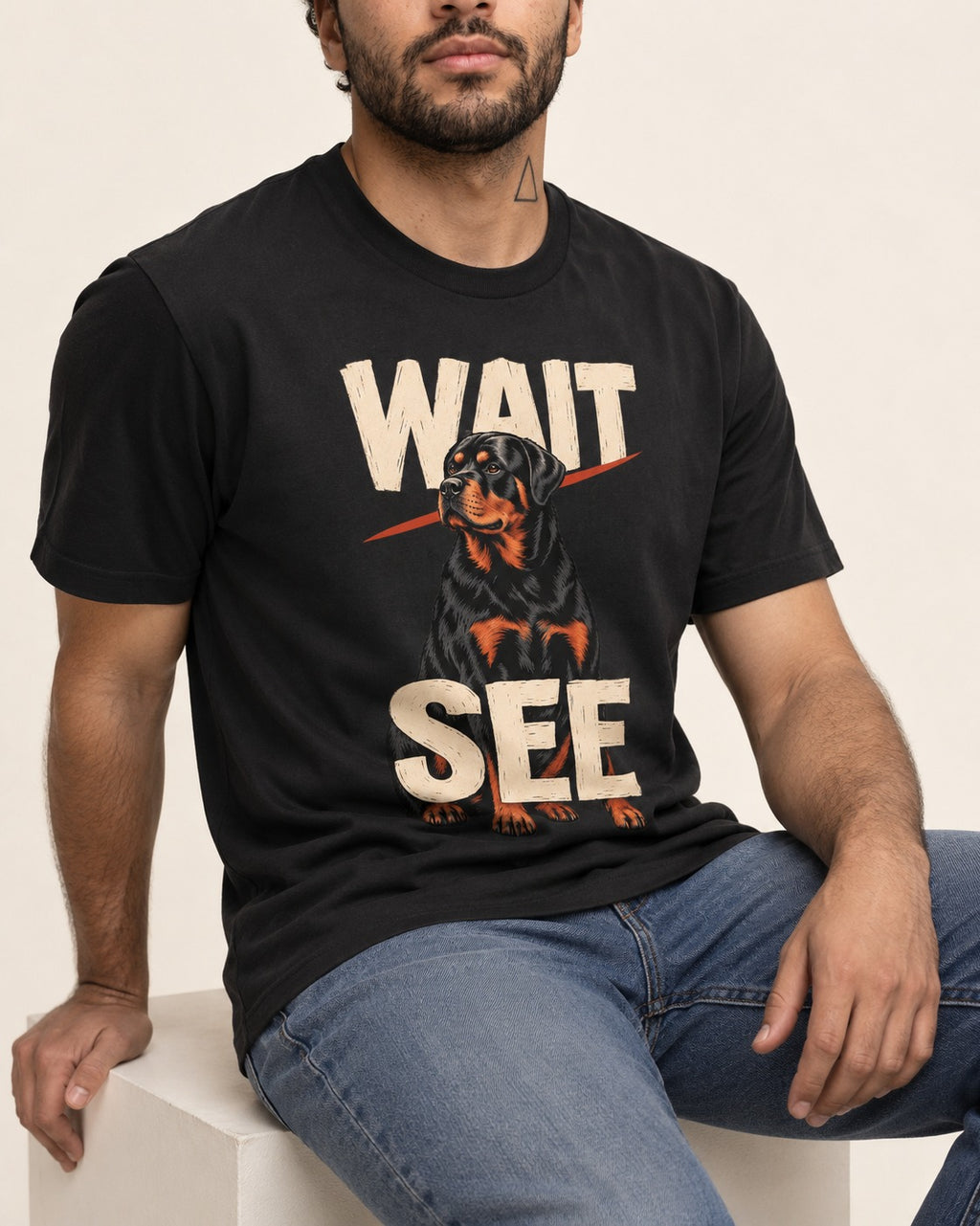 Wait See Rottweiler Seated Slash Graphic T-Shirt in Black, worn by a seated model