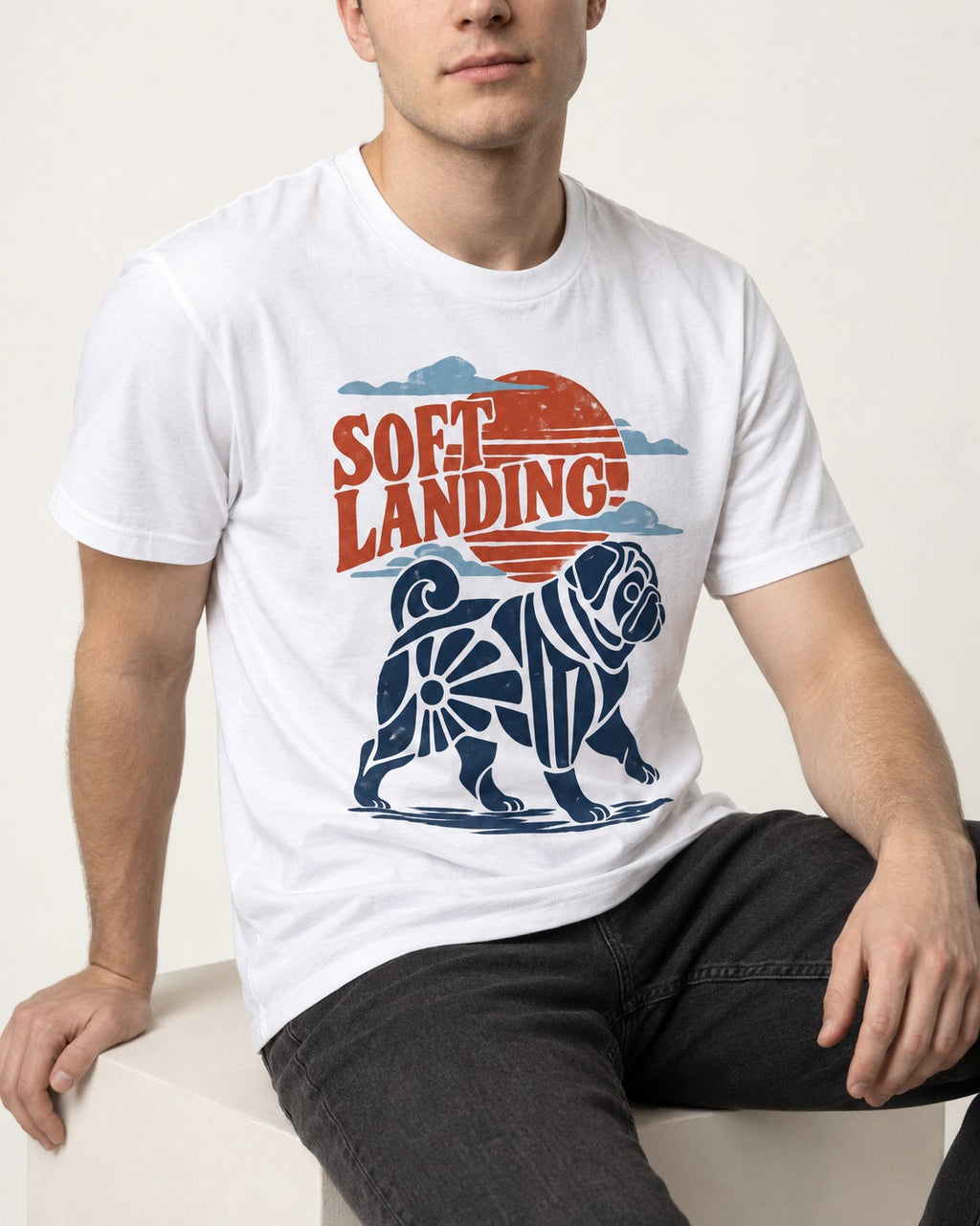 Pug's Soft Landing T-Shirt in White, worn by a seated model
