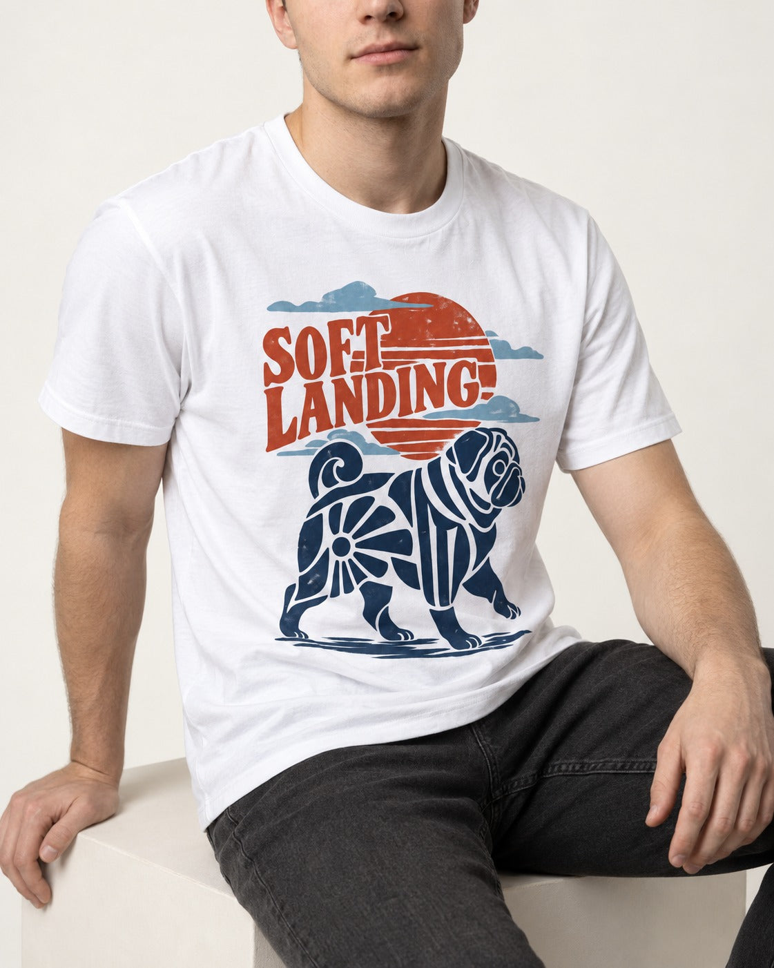 Pug's Soft Landing T-Shirt in White, worn by a seated model