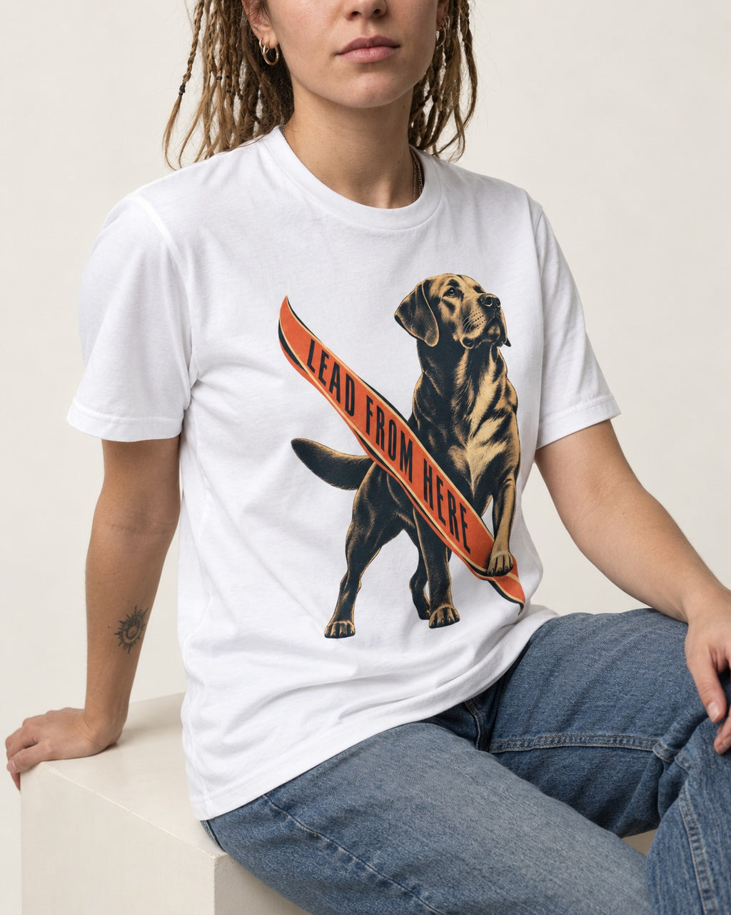 Lead From Here Labrador Retriever T-Shirt in White, worn by a seated model