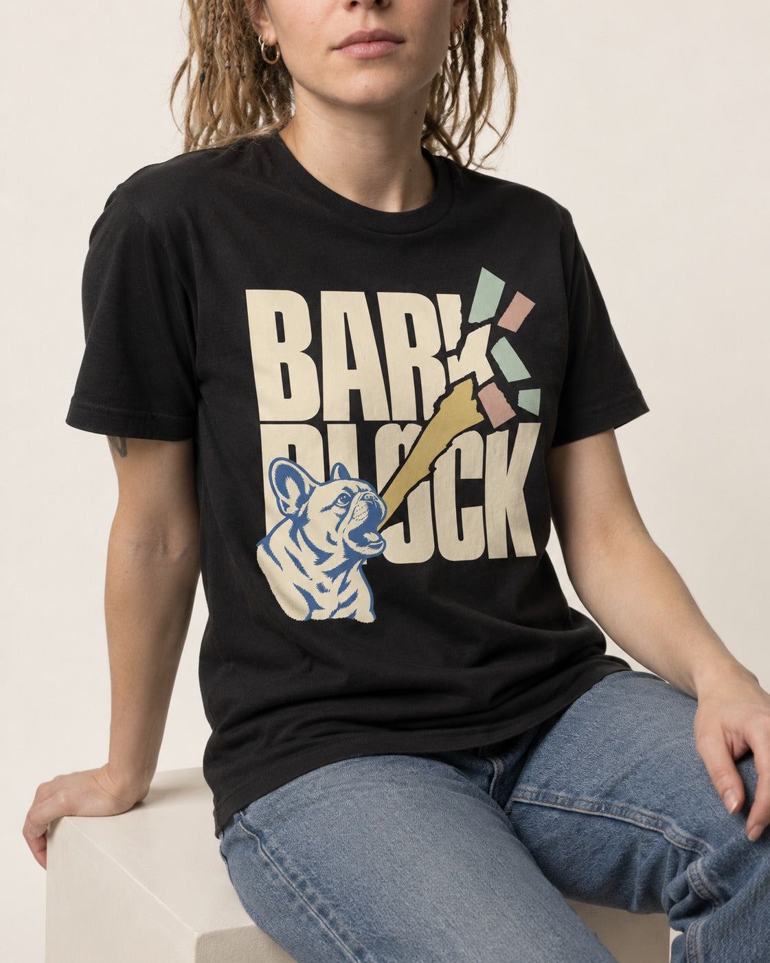 Frenchie Bark Breaks Bark Block Graphic T-Shirt in Black, worn by a seated model