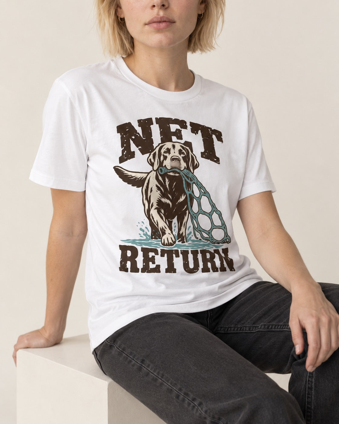 Net Return Labrador Retriever T-Shirt in White, worn by a seated model