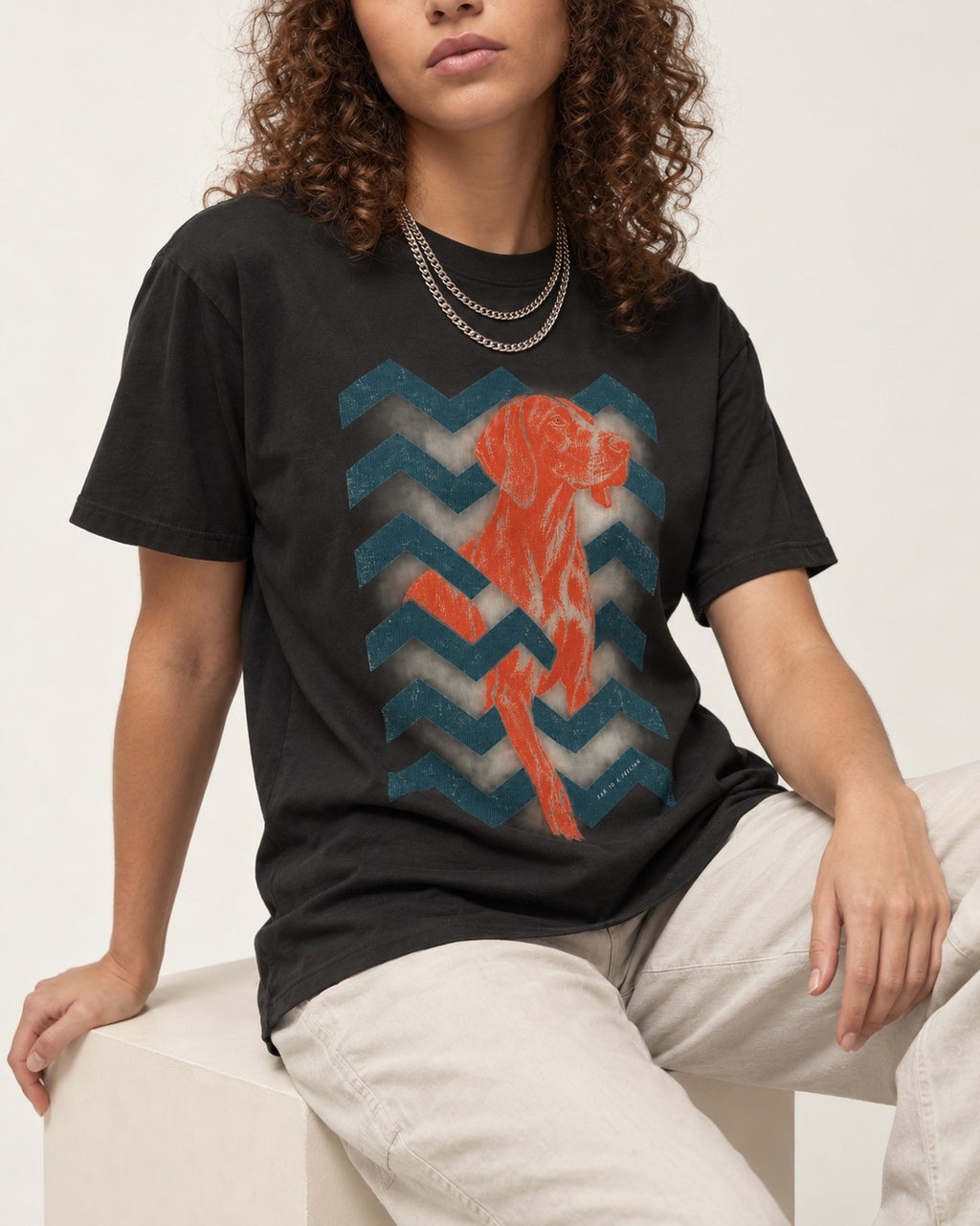 German Shorthaired Pointer Far Is a Feeling Chevron Graphic T-Shirt in Black, worn by a seated model