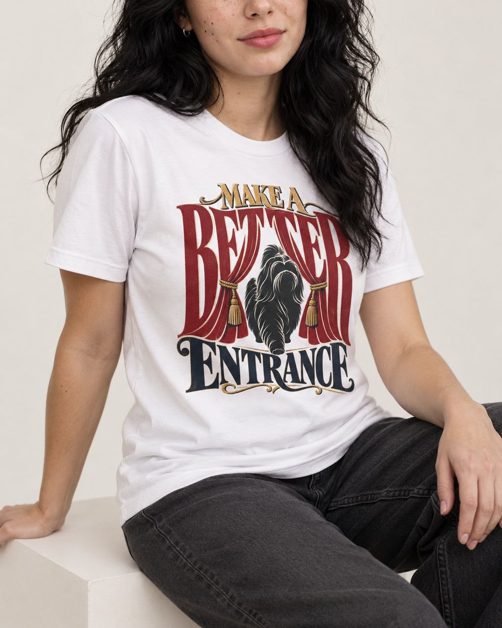 A Better Shih Tzu Entrance T-Shirt in White, worn by a seated model