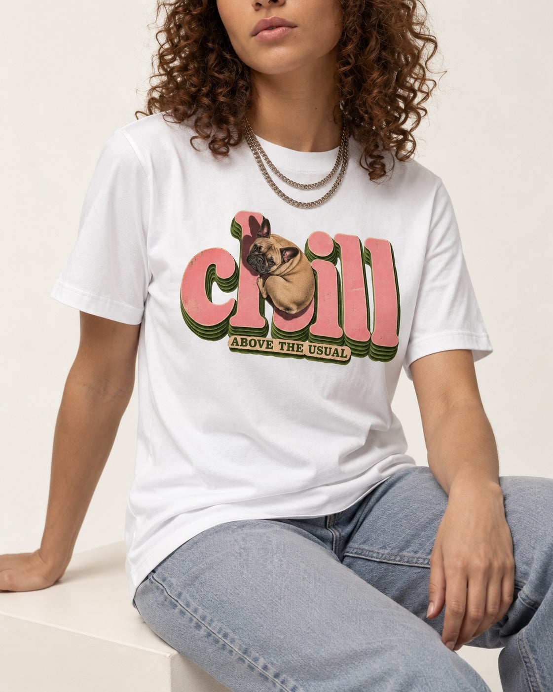 Frenchie Chill T-Shirt in White, worn by a seated model