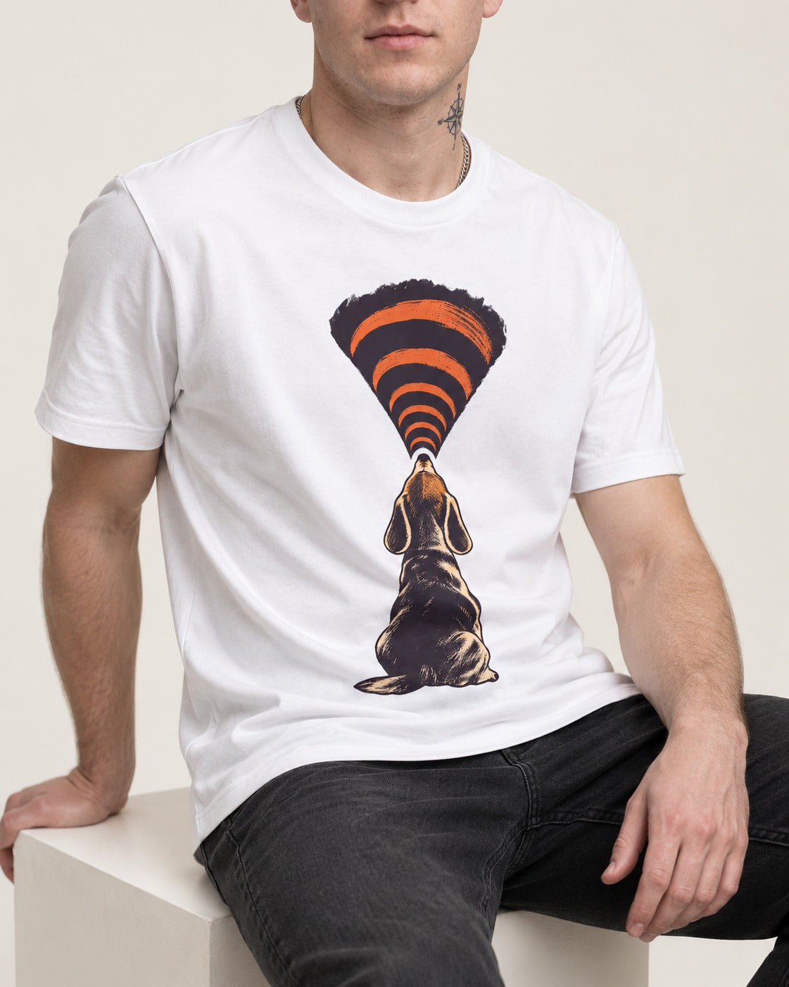 Beagle Broadcast T-Shirt in White, worn by a seated model