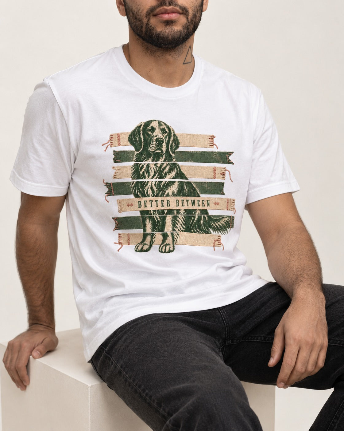 Golden Retriever Better Between T-Shirt in White, worn by a seated model