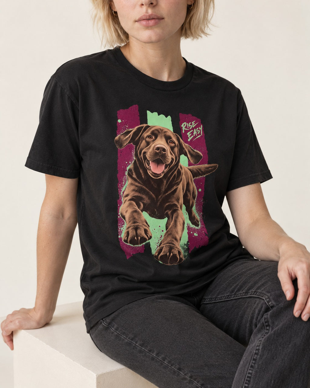 Labrador Retriever Rise Easy Running Chocolate Lab Graphic T-Shirt in Black, worn by a seated model