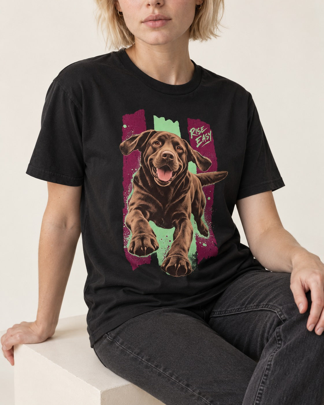 Labrador Retriever Rise Easy Running Chocolate Lab Graphic T-Shirt in Black, worn by a seated model