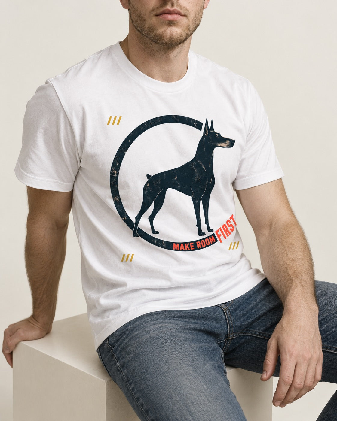 Make Room First Doberman T-Shirt in White, worn by a seated model