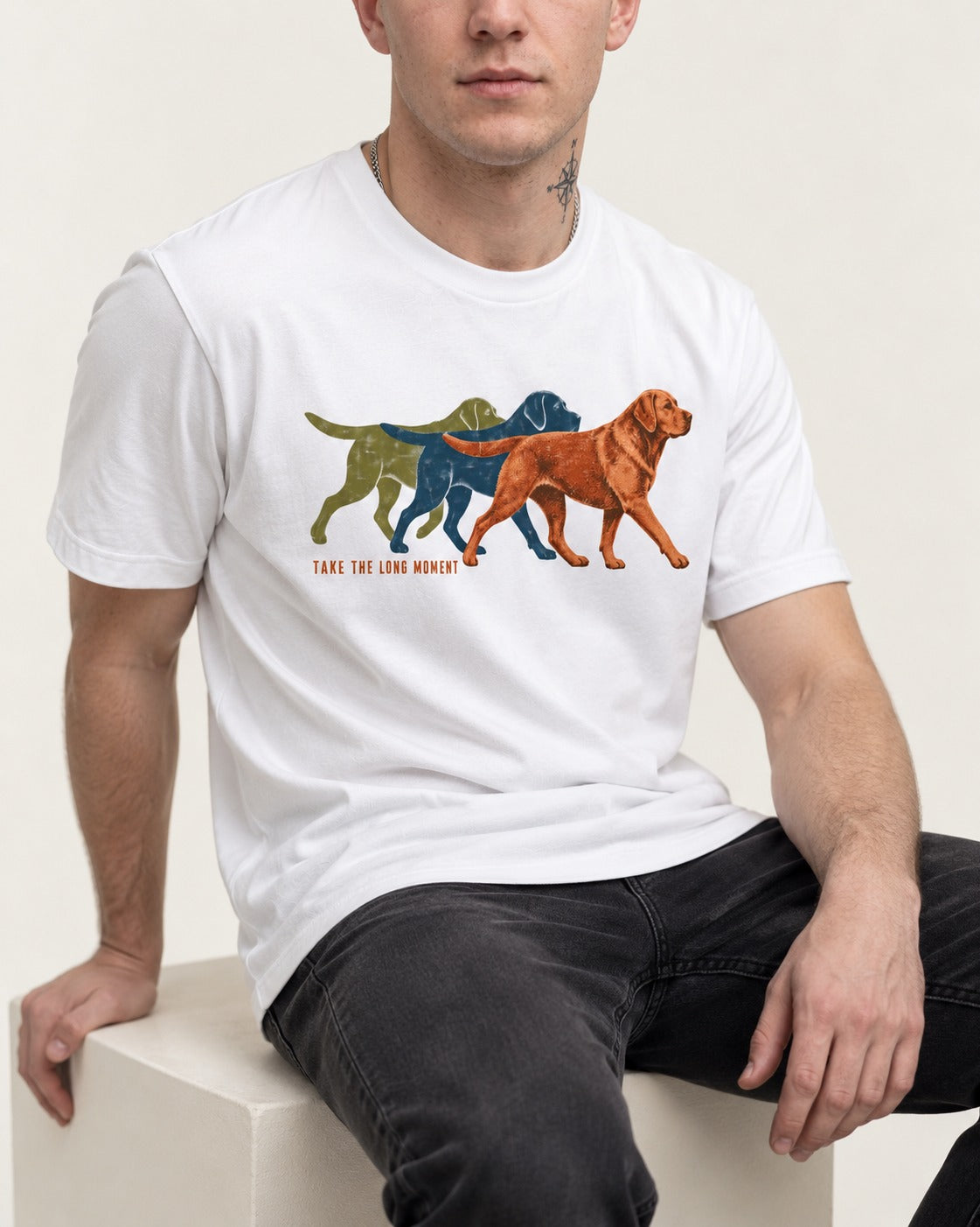 Take the Long Moment Labrador Retriever T-Shirt in White, worn by a seated model