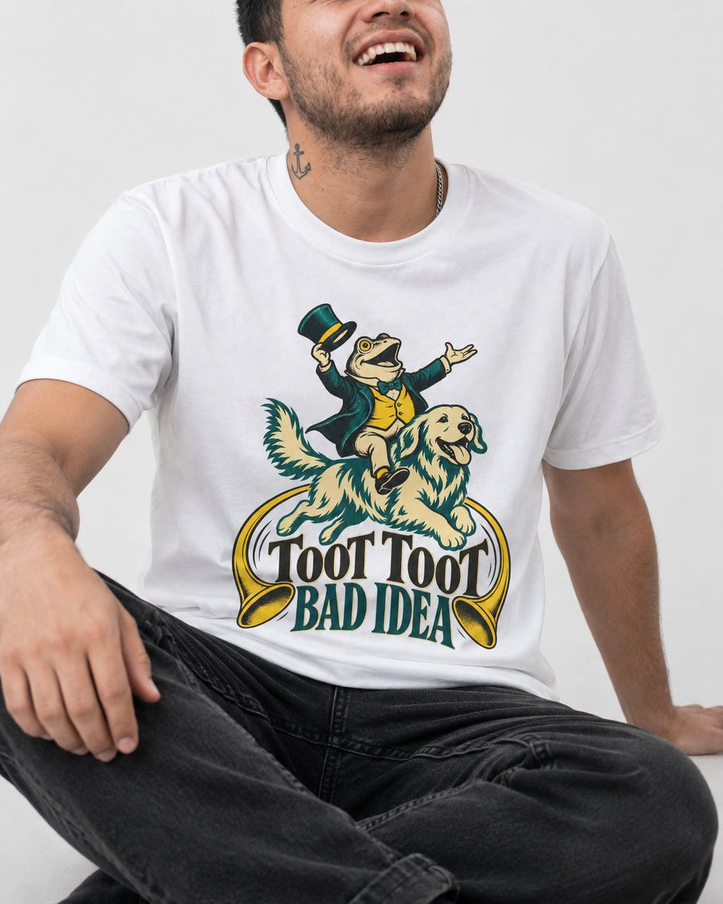 Golden Retriever Toot Toot Bad Idea T-Shirt in White, worn by a seated model