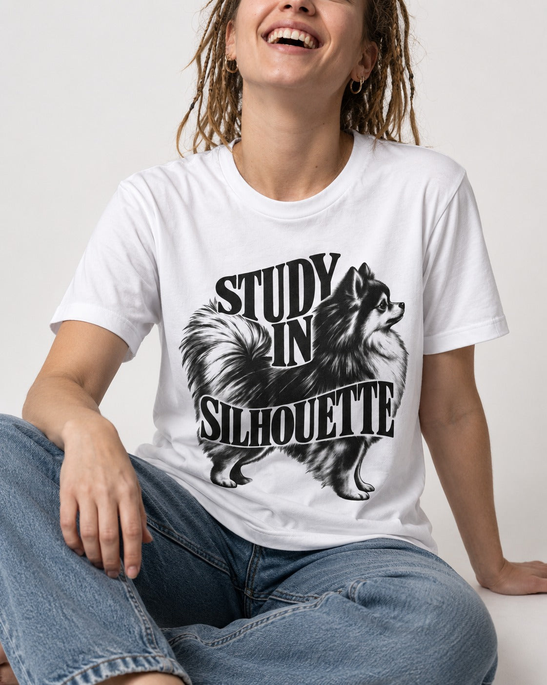Pomeranian Study in Silhouette T-Shirt in White, worn by a seated model