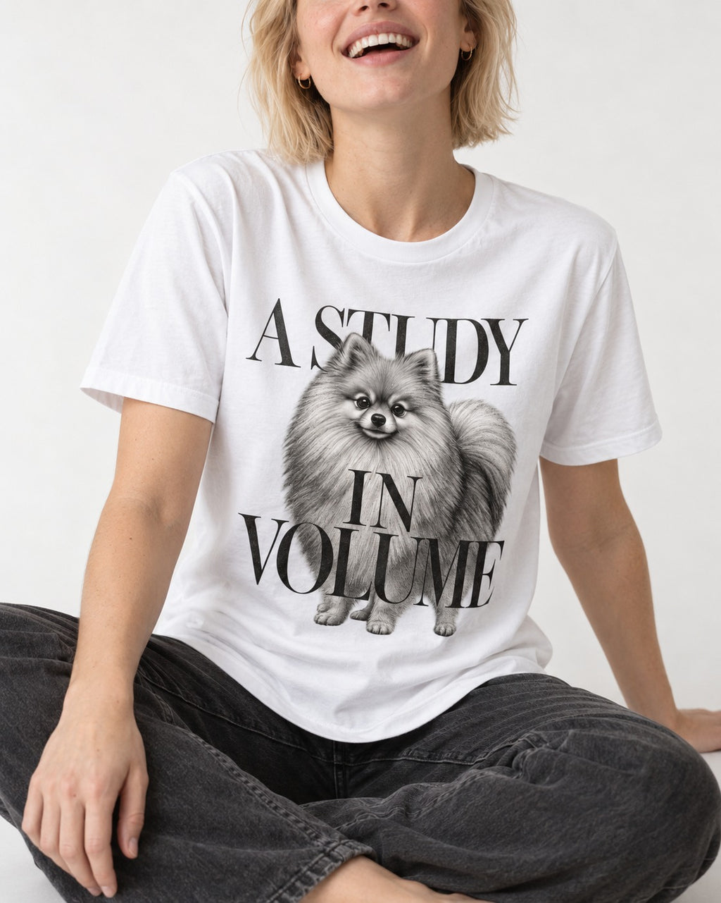 Pomeranian Study in Volume T-Shirt in White, worn by a seated model