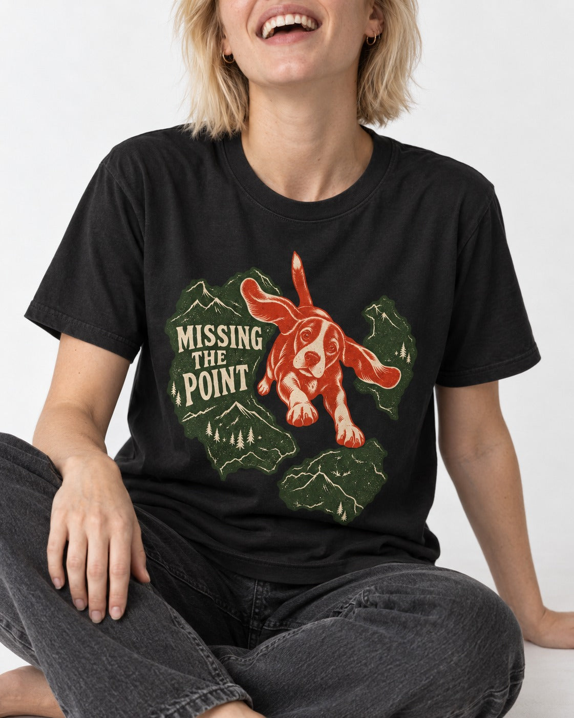 Missing The Point Beagle Trail T-Shirt in Black, worn by a seated model