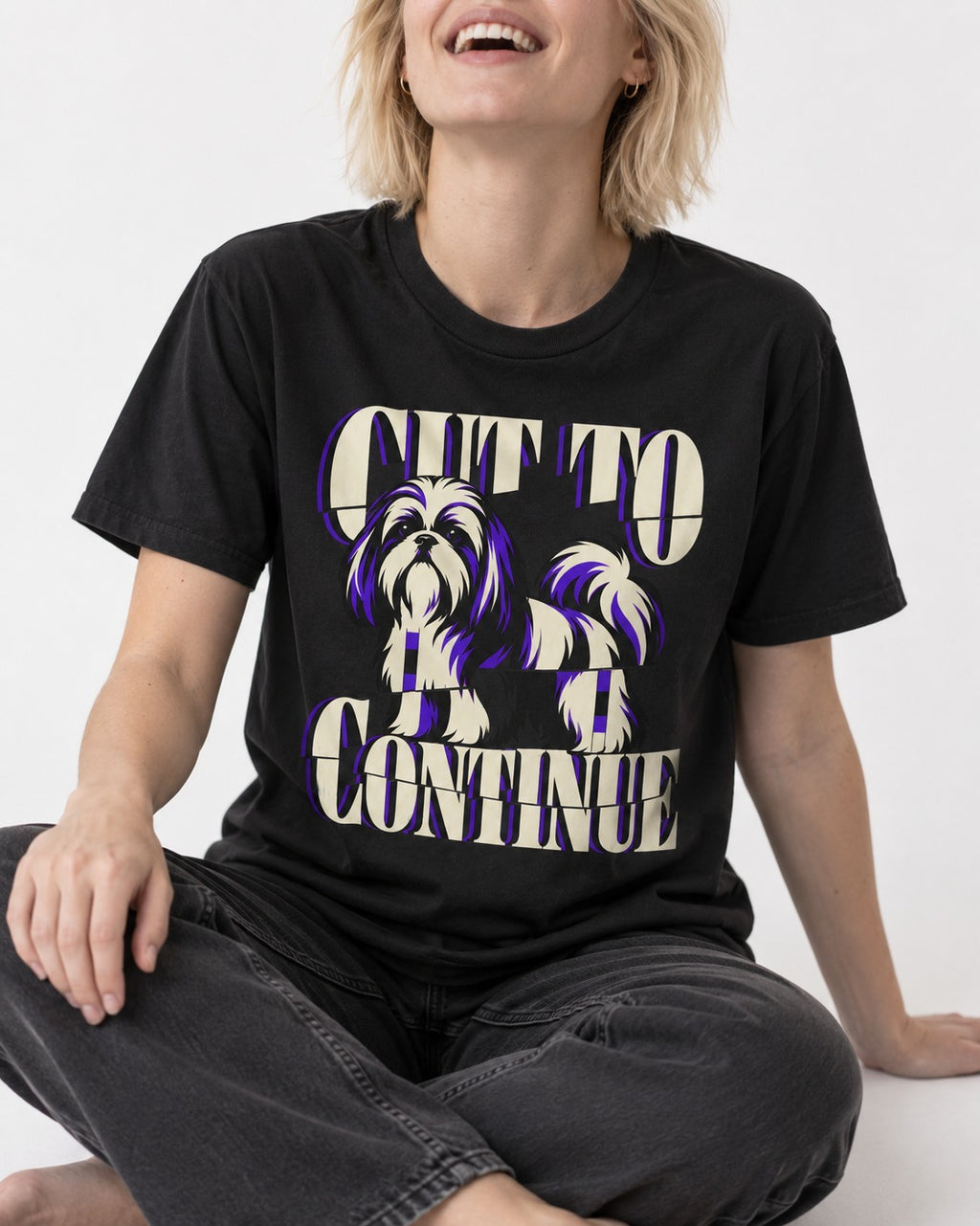Shih Tzu Cut to Continue Dimensional Typography Graphic T-Shirt in Black, worn by a seated model