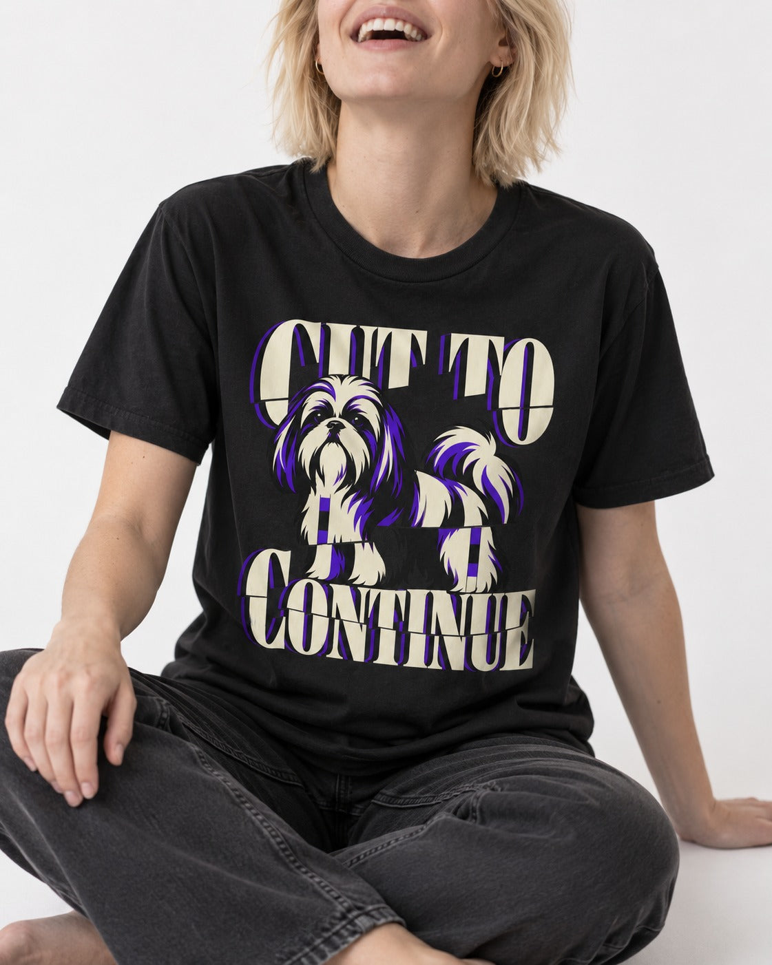 Shih Tzu Cut to Continue Dimensional Typography Graphic T-Shirt in Black, worn by a seated model