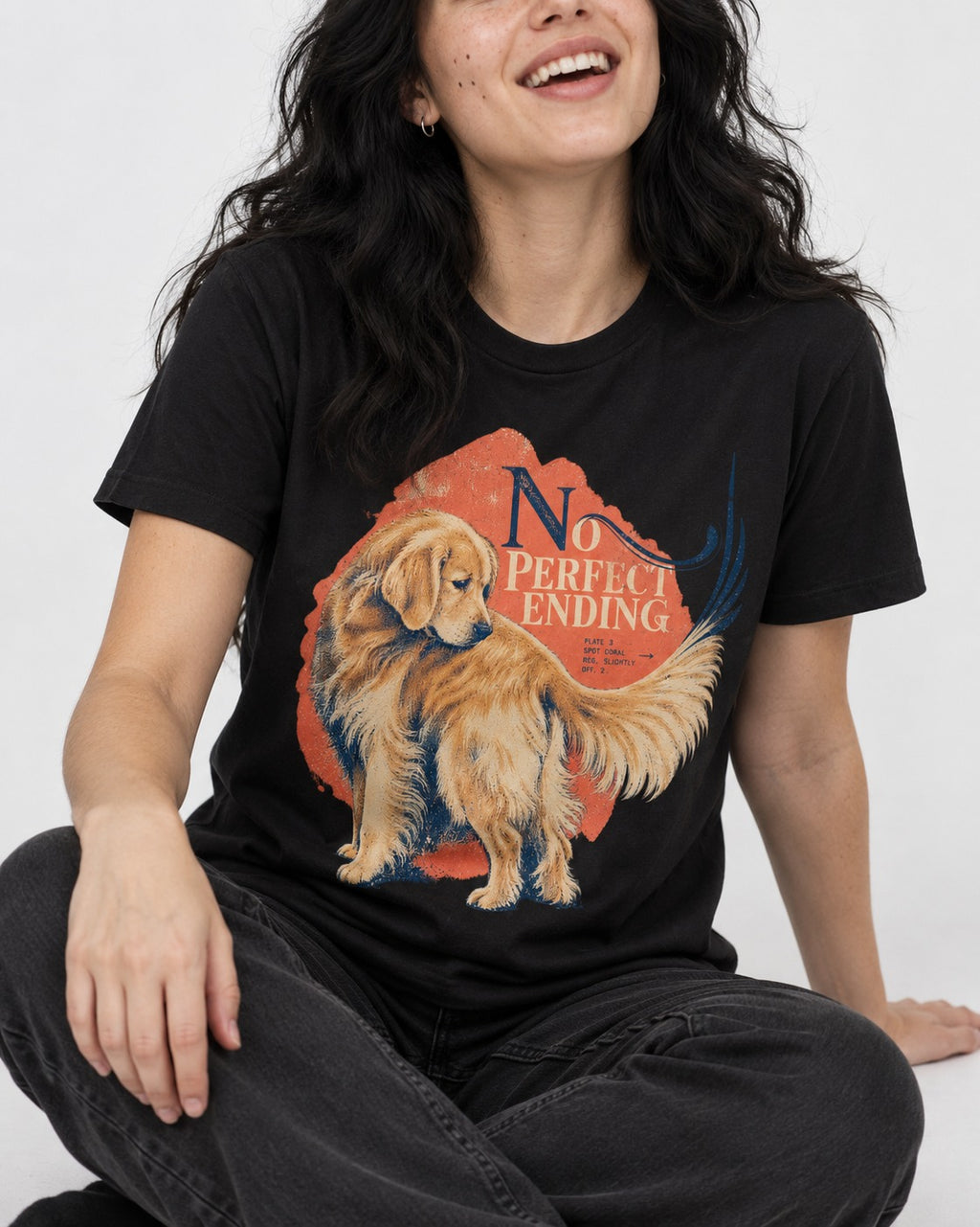 Golden Retriever No Perfect Ending Misregistration Graphic T-Shirt in Black, worn by a seated model