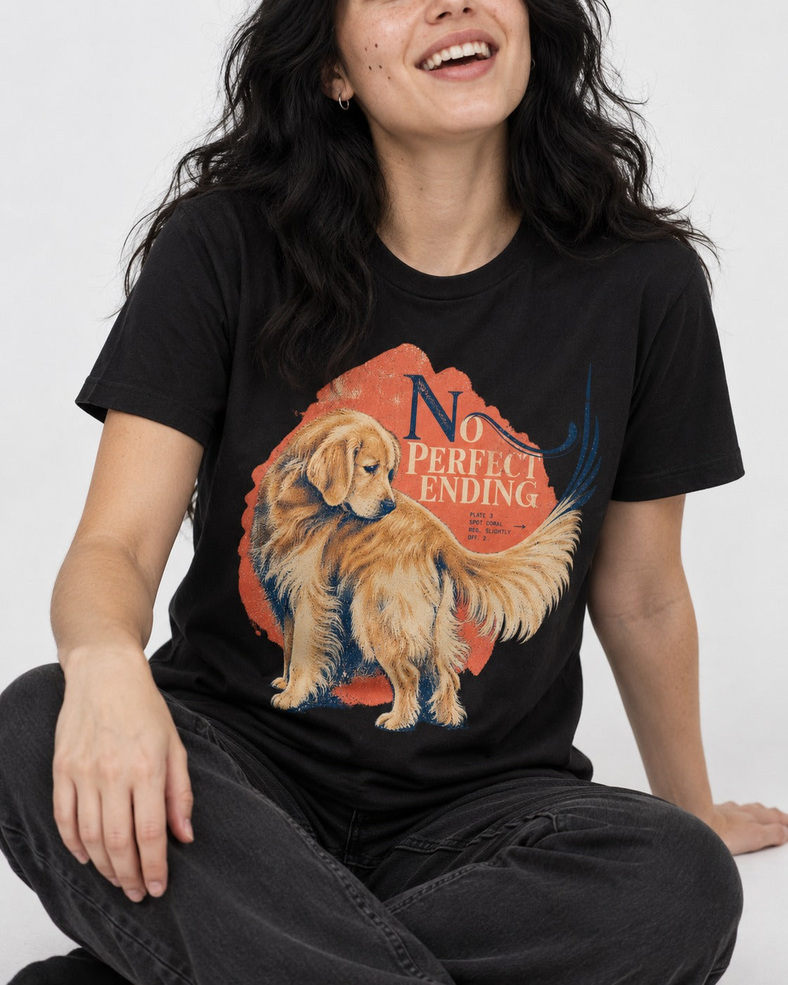 Golden Retriever No Perfect Ending Misregistration Graphic T-Shirt in Black, worn by a seated model