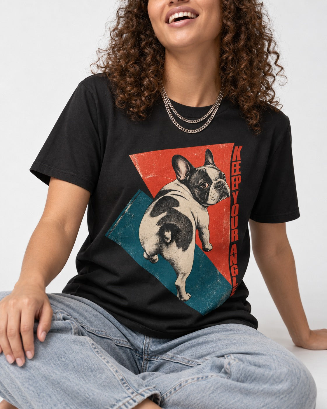 Frenchie Keep Your Angle Geometric Graphic T-Shirt in Black, worn by a seated model