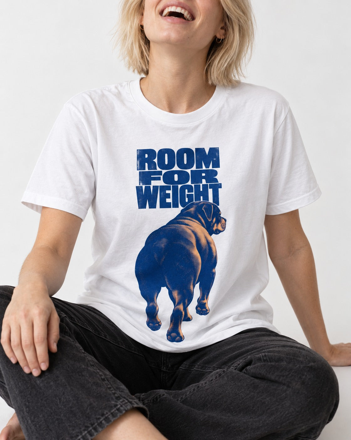 Room for Weight Rottweiler T-Shirt in White, worn by a seated model