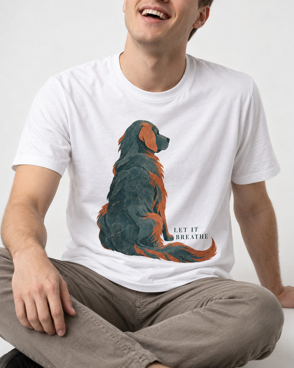 Let It Breathe Golden Retriever T-Shirt in White, worn by a seated model