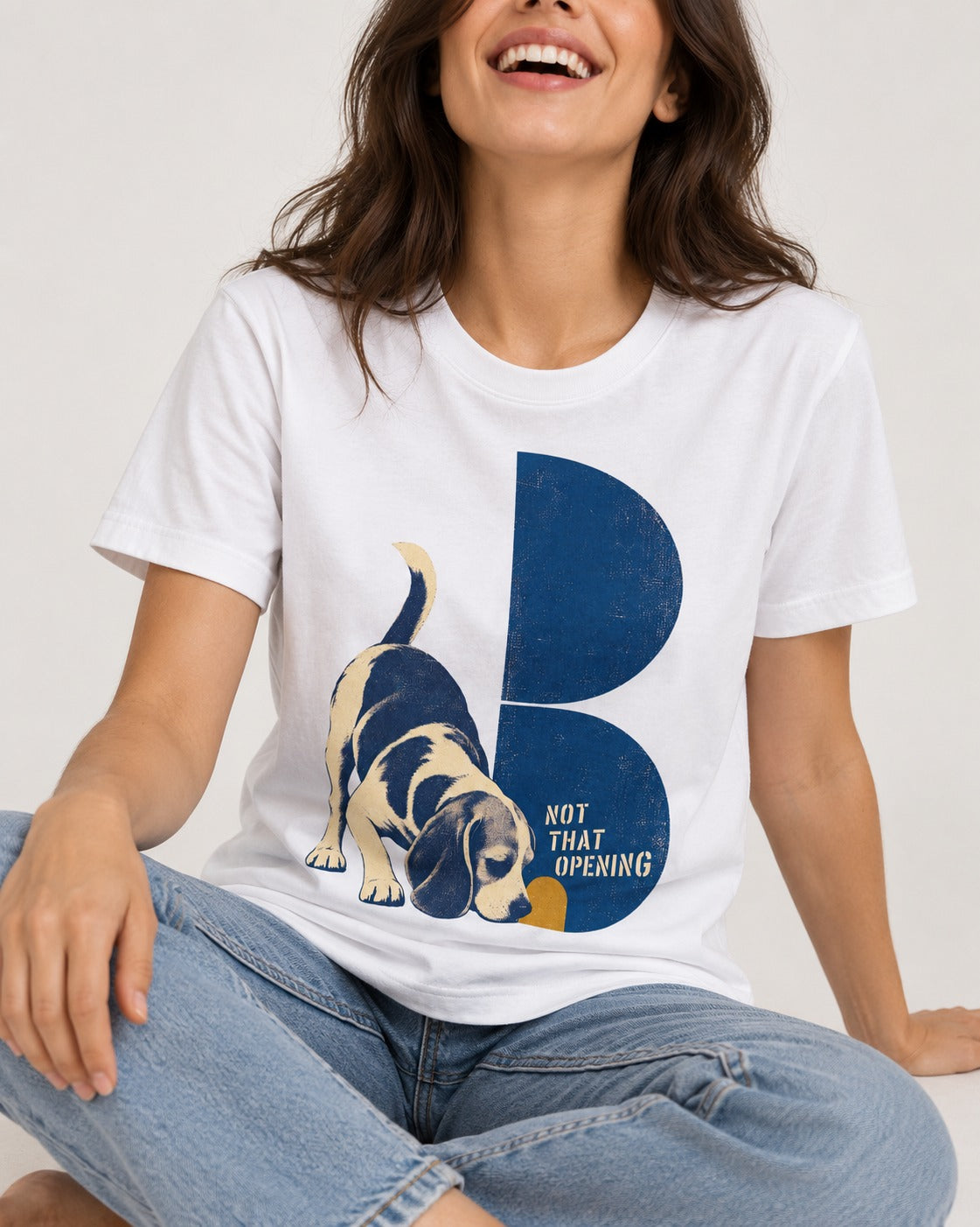 Not That Opening Beagle T-Shirt in White, worn by a seated model