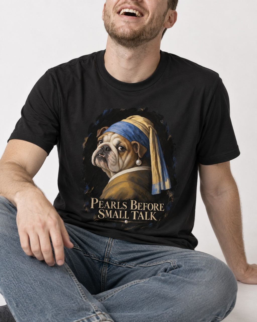English Bulldog Pearls Before Small Talk Portrait T-Shirt in Black, worn by a seated model