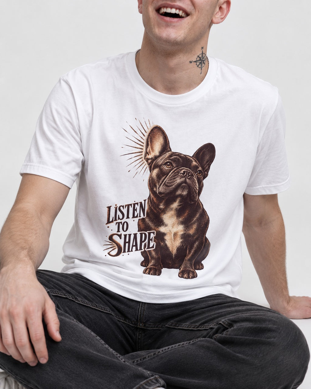 Listen to Shape Frenchie T-Shirt in White, worn by a seated model