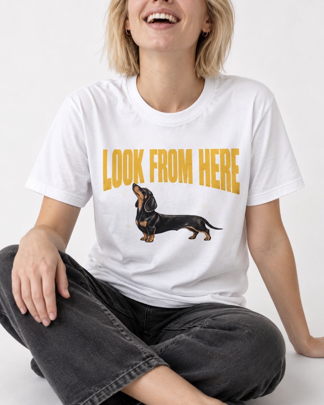 Dachshund Look From Here T-Shirt in White, worn by a seated model