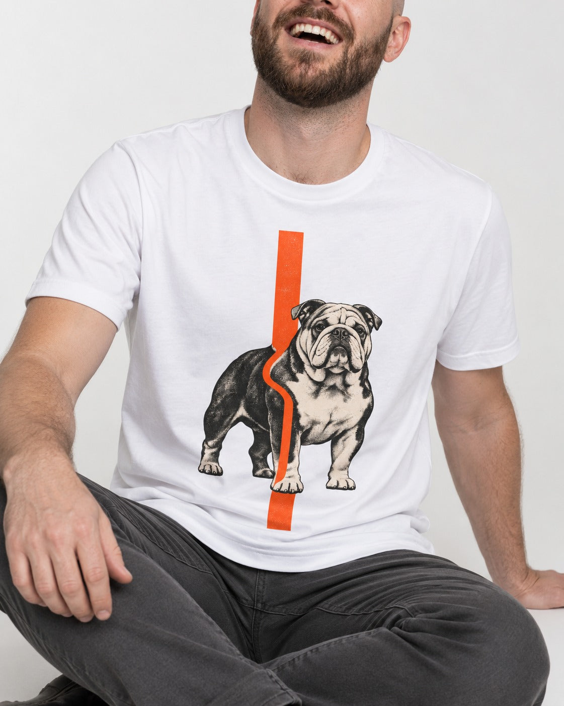 English Bulldog Quiet Strength T-Shirt in White, worn by a seated model