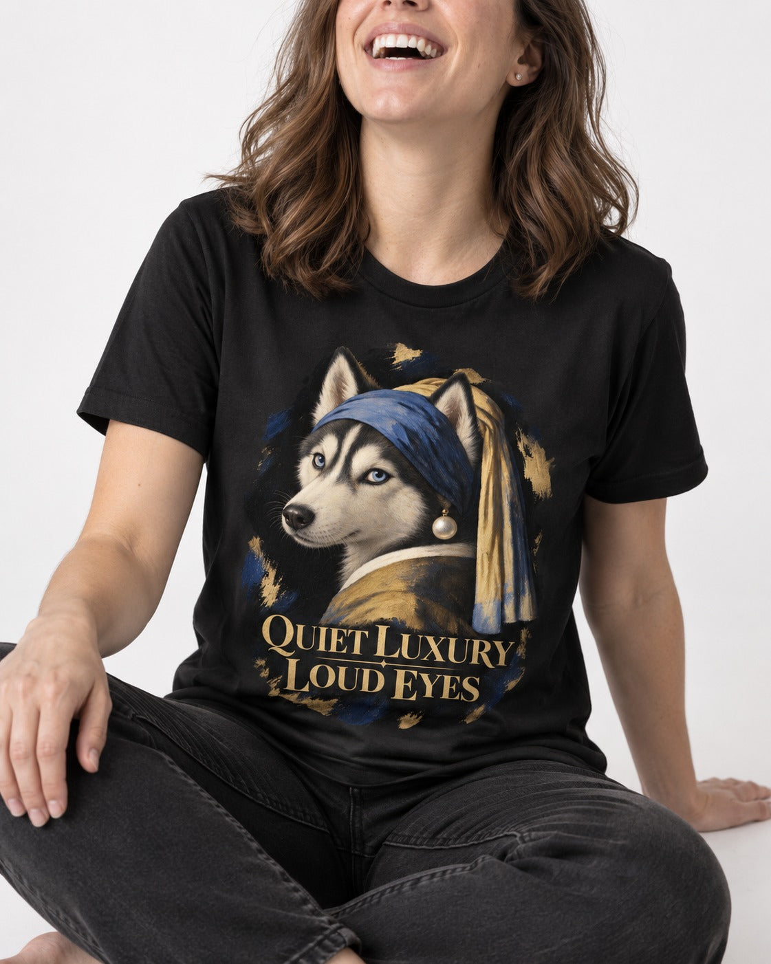Husky Quiet Luxury Loud Eyes Pearl Portrait Graphic T-Shirt in Black, worn by a seated model