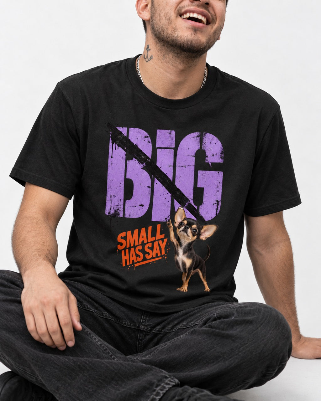Chihuahua Big Small Has Say Diagonal Slash Graphic T-Shirt in Black, worn by a seated model