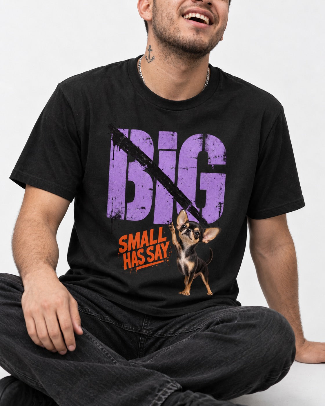 Chihuahua Big Small Has Say Diagonal Slash Graphic T-Shirt in Black, worn by a seated model