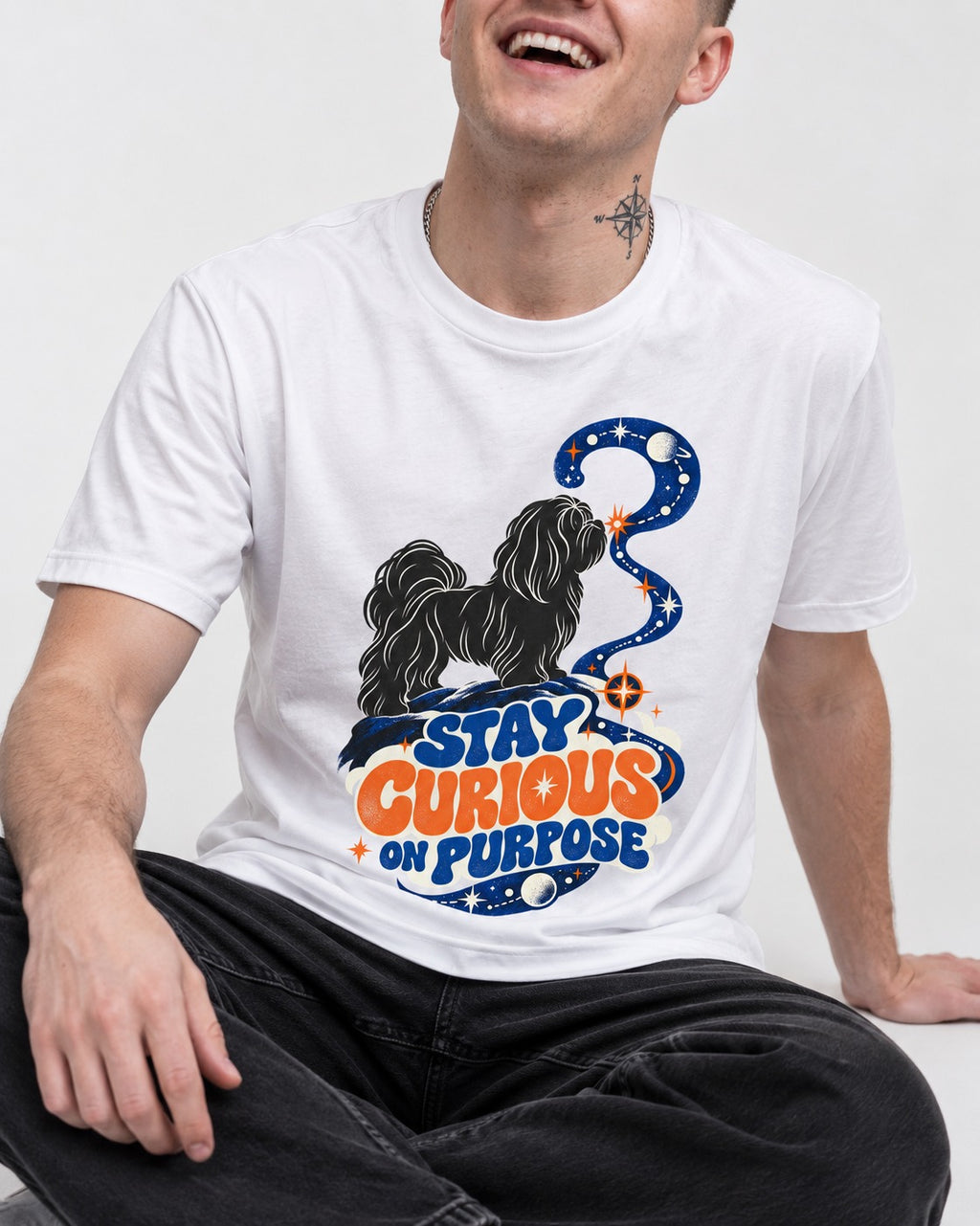 Stay Curious on Purpose Shih Tzu T-Shirt in White, worn by a seated model