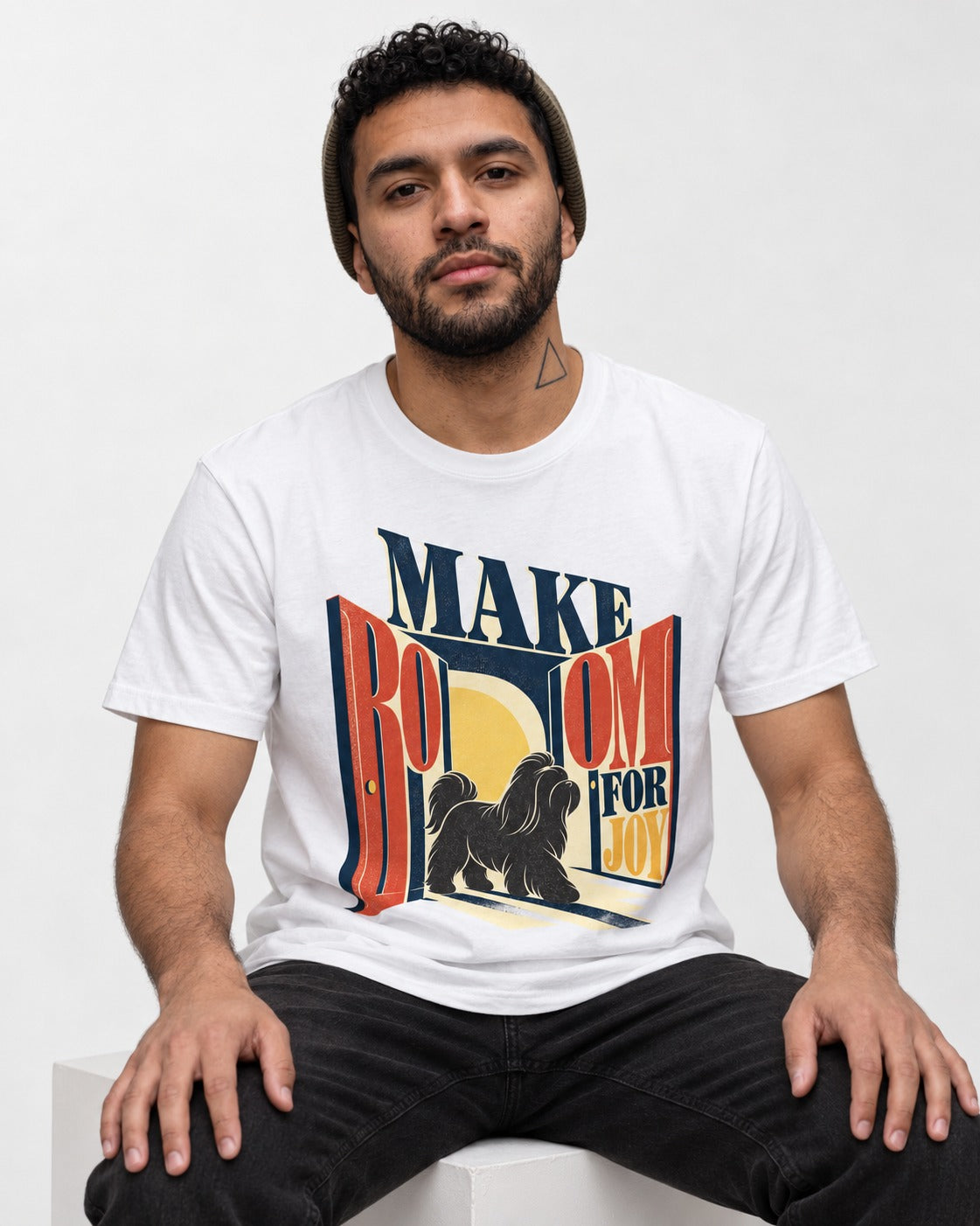Shih Tzu Make Room for Joy Doorway Graphic T-Shirt in White, worn by a seated model