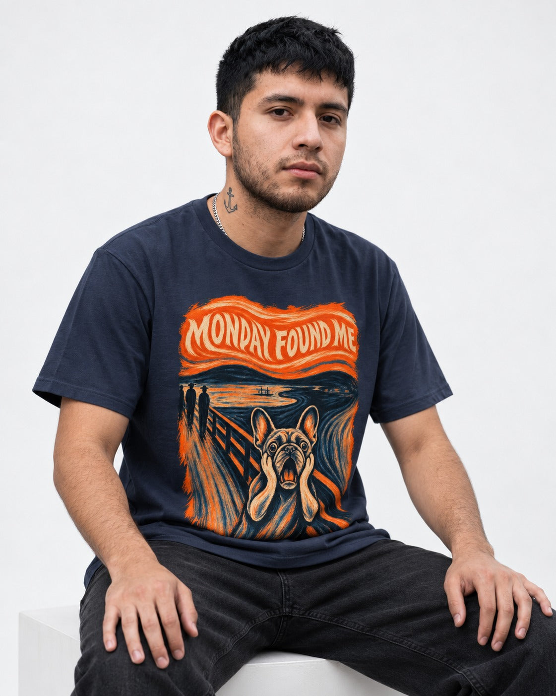 Frenchie Monday Found Me Scream Graphic 194 T-Shirt in Navy, worn by a seated model