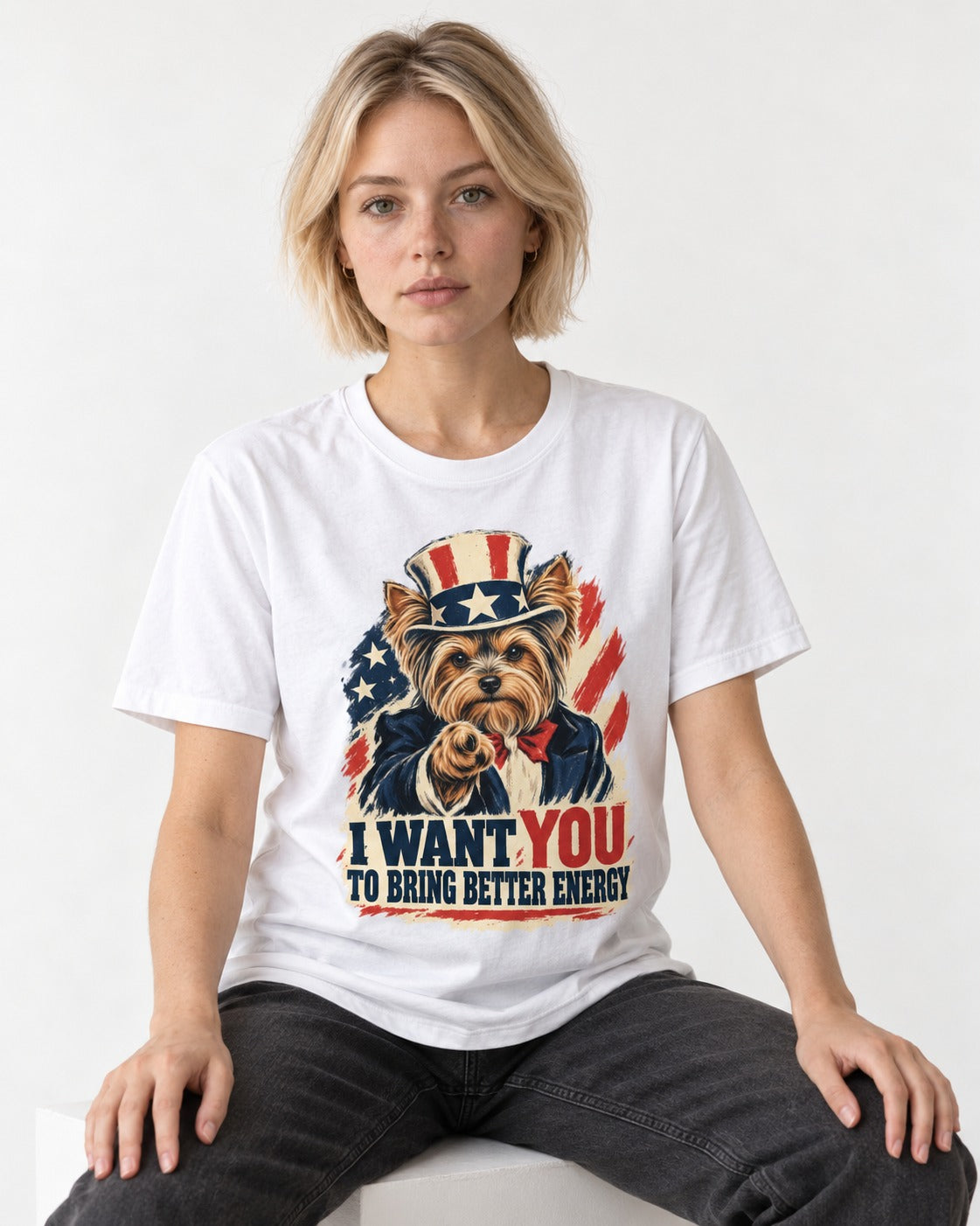 Yorkshire Terrier I Want You to Bring Better Energy Recruitment Poster Graphic T-Shirt in White, worn by a seated model