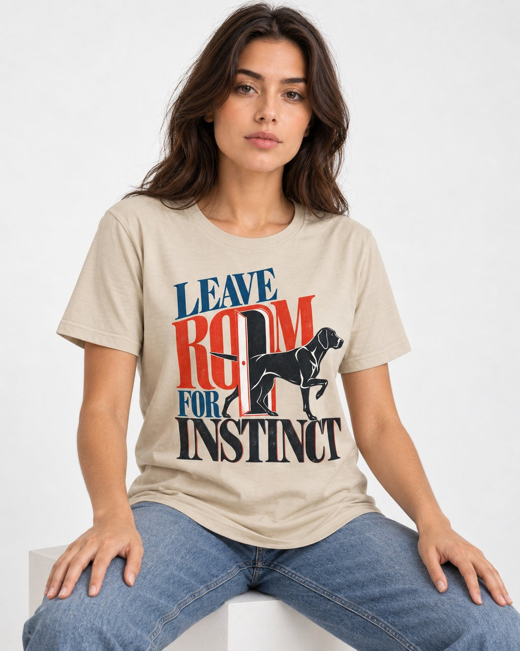 Leave Room for Instinct German Shorthaired Pointer T-Shirt in Sand, worn by a seated model