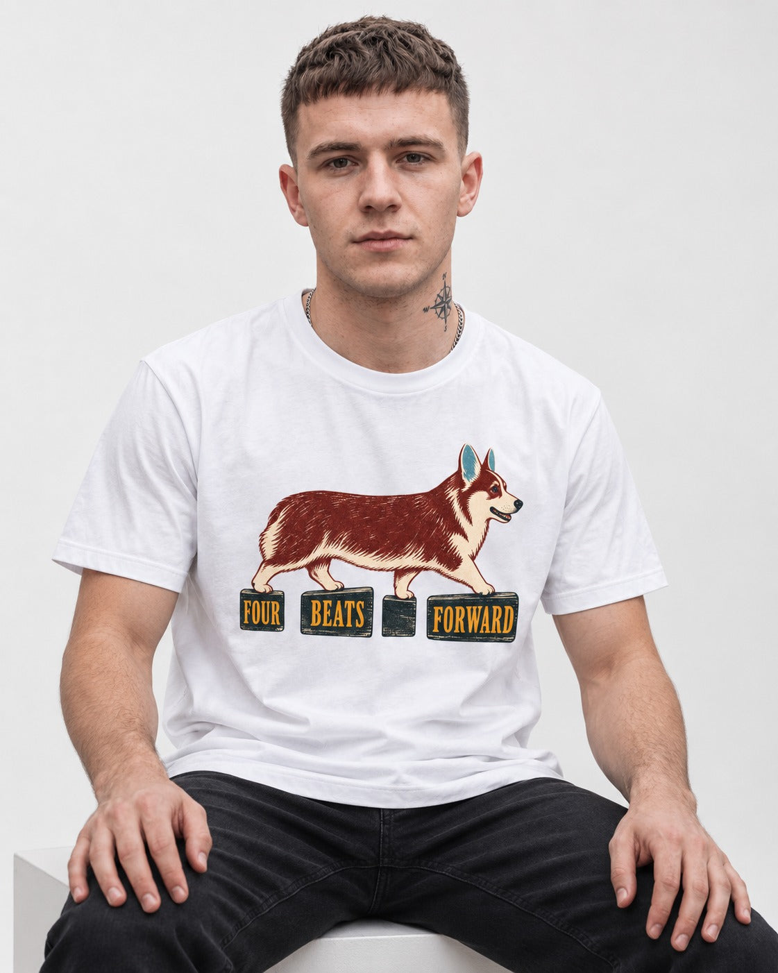 Corgi Four Beats Forward T-Shirt in White, worn by a seated model