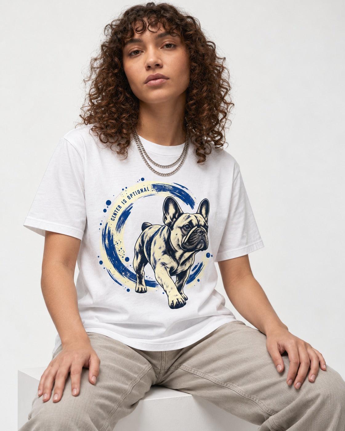 Frenchie Center Is Optional Brush Circle Graphic T-Shirt in White, worn by a seated model