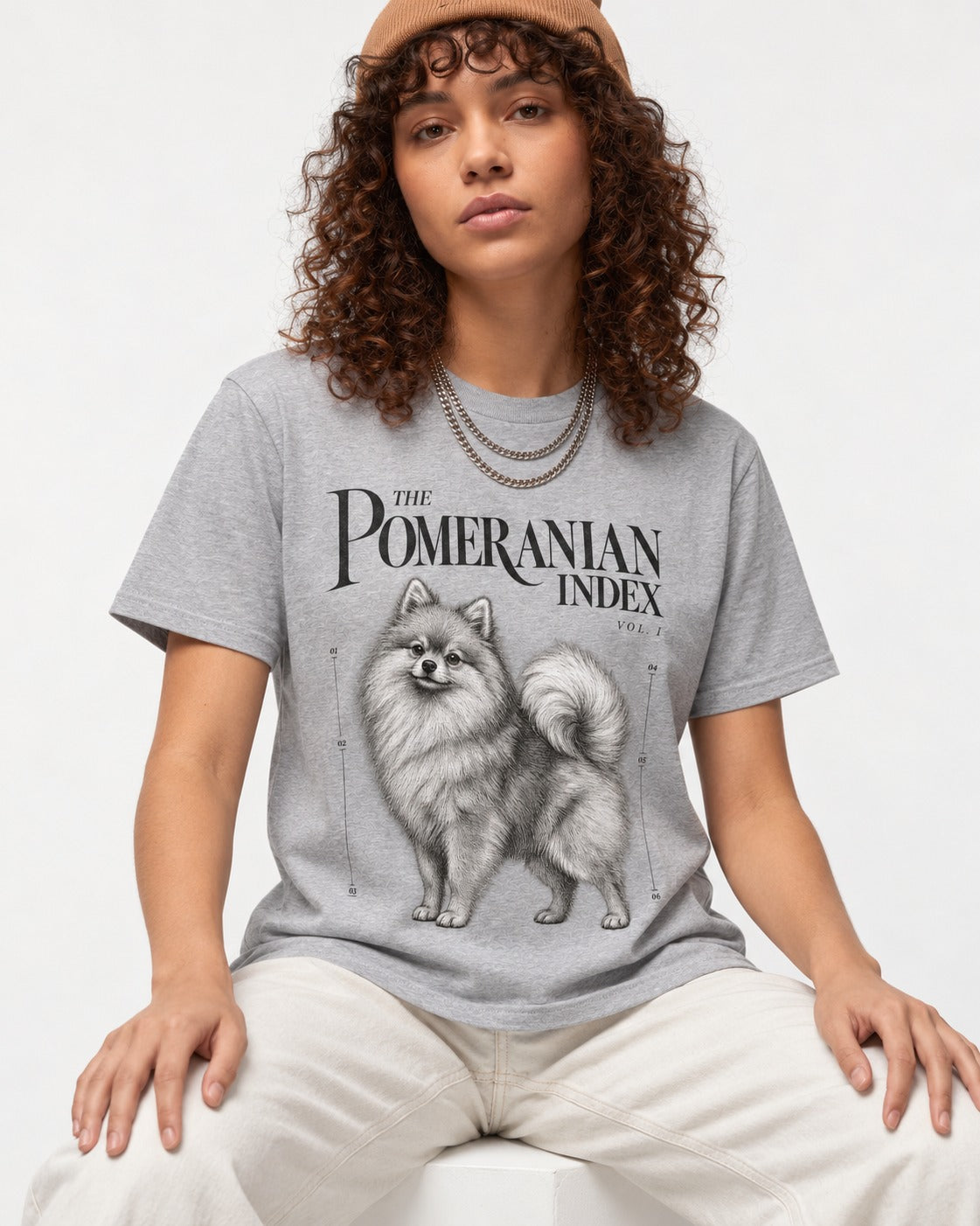 The Pomeranian Index T-Shirt in Sport Grey, worn by a seated model